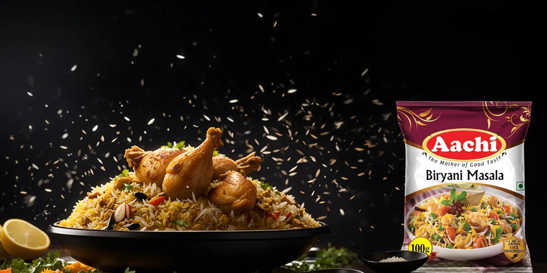 Aachi Biryani Masala used to prepare aromatic chicken biryani, with spices falling over the dish against a dark background.